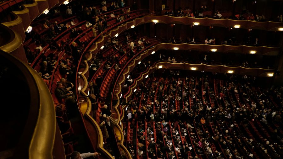 Opera Inclusion Audience waiting, seated, in a theatre, opera house in New York. 