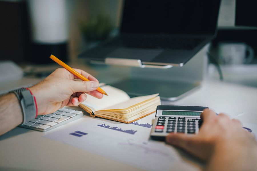 Finances Audit Currencies and finance. Stock exchange. Calculator on the table 