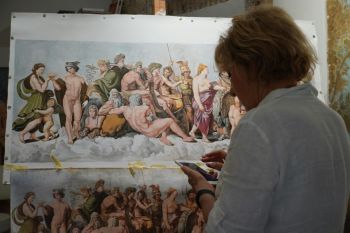 artwork restoration Artist working on a detailed classical painting against a studio background, with various figures depicted on the canvas.