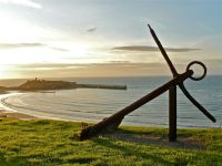 Mariner Looking out to sea over Peel Beach and Peel Castle anchor,isle of man,peel