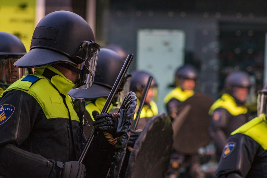 Police weapon A police line against hooligans after a lost football match rotterdam,netherlands,coolsingel