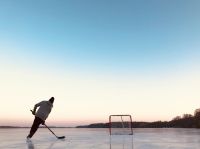 Ice hockey Pond hockey in Minnesota.  hockey,sports,skating