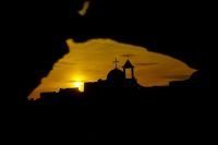 Religious conflict Sunset embraces the church in old Mosul After ISIS destroyed it, Iraq 