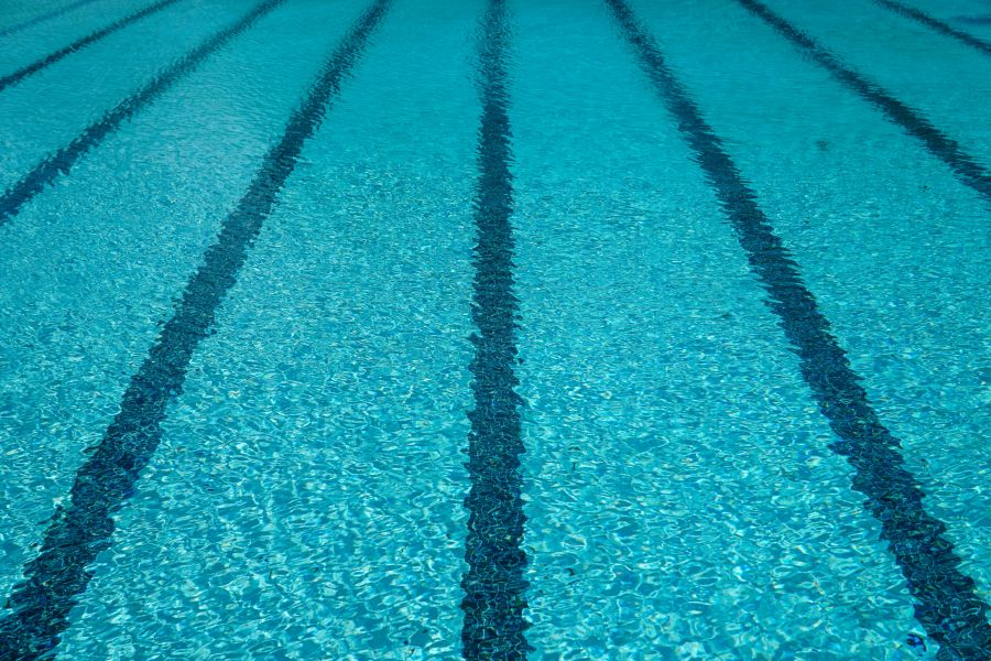 Swimming pool Striped lines beneath clear cold blue swimming pool water during the summer ready for a swim pool,blue,swimming