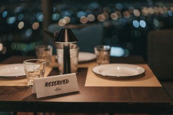 Restaurant Awards A picture describing a fine dining restaurant table that is reserved for a special evening with your loved one with an elegant ambience, upscale table setting and a menu full of delicious dishes.