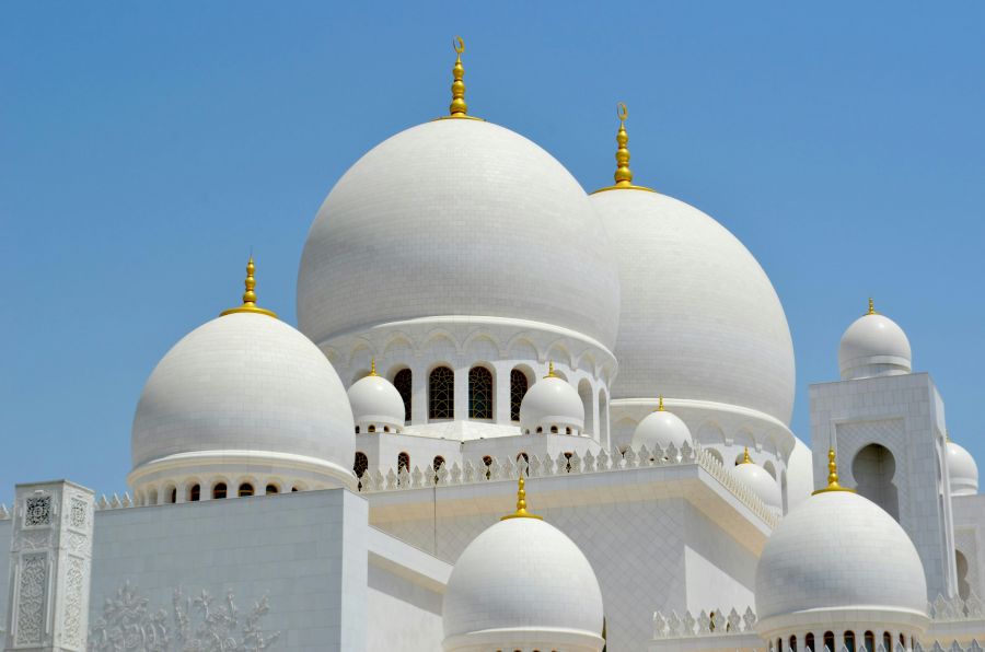 mosque In one of the greatest cities of the world, Abu Dhabi, rests the most beautiful religious monument I have ever seen. All white, polished, surrounded by gold, pearls, diamonds and countless other precious stones. It is a place to admire every single view, every single carpet or tile in the floor.