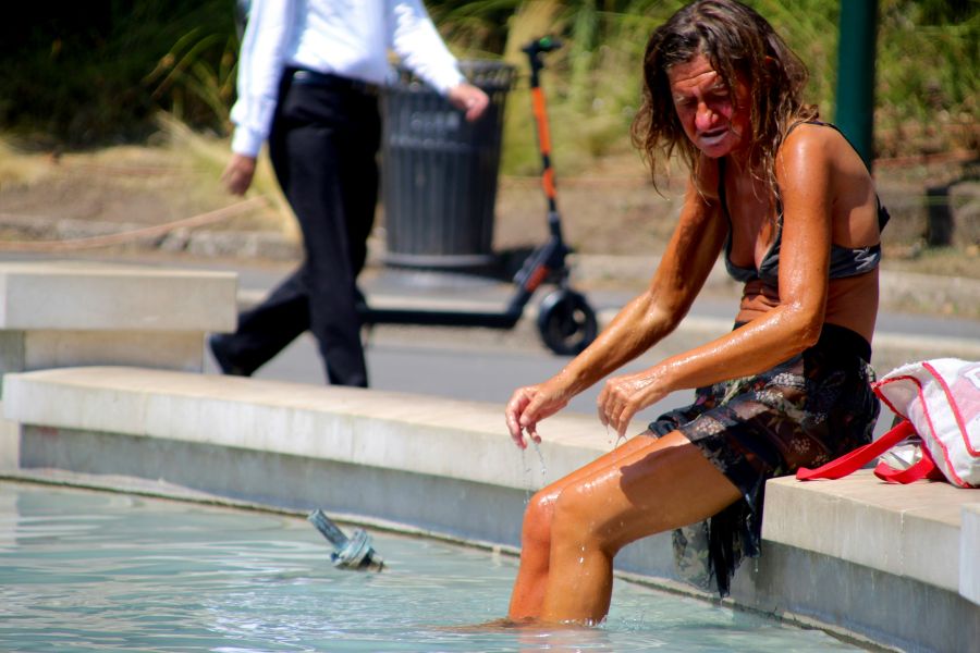 homeless women Homeless women washing herself in the fountain 