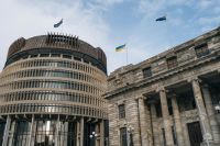 City council New Zealand Parliament Buildings in Wellington, New Zealand with the Beehive, Parliament House and the Parliamentary Library. The Ukraine flag can be seen raised. 
