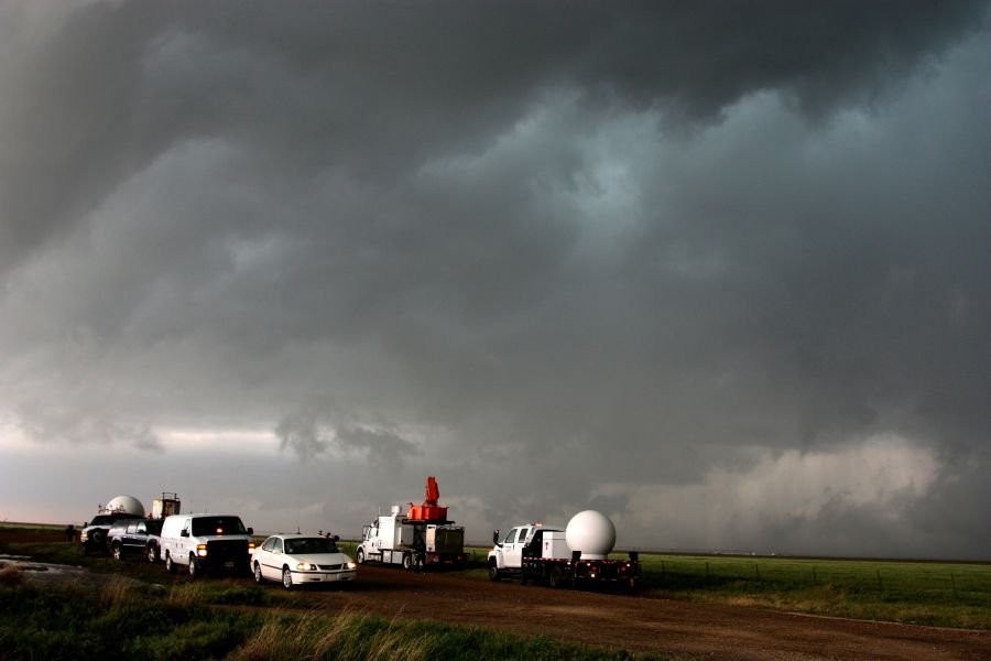 Weather Climate A fleet of VORTEX2 vehicles tracks a supercell thunderstorm near Dumas. The blue-green color in the cloud is associated with large hail. weather,thunderstorm,storm