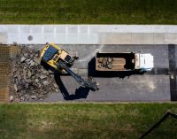 roadwork construction This drone shot came from the progress on the high school track in town. The old track needed to be tore completely out, the base dried out, and a new base laid. Truck after trucked hauled the old asphalt out. It was amazing to watch them work. 