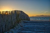 Toulon This photo was taken on the way to a beach close to Toulon at sunset. I very much liked the wooden path which lead to the beach and the setting sun shining throught it. toulon,france,sea