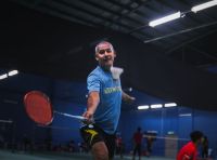 sports competition perfectly timed shot while a man is about to lift the shuttle badminton,bangi,selangor