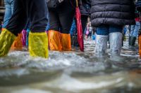 Floods Tourists try to stay dry in a flooded St Mark’s Sq, venice natural disaster,venezia,italy