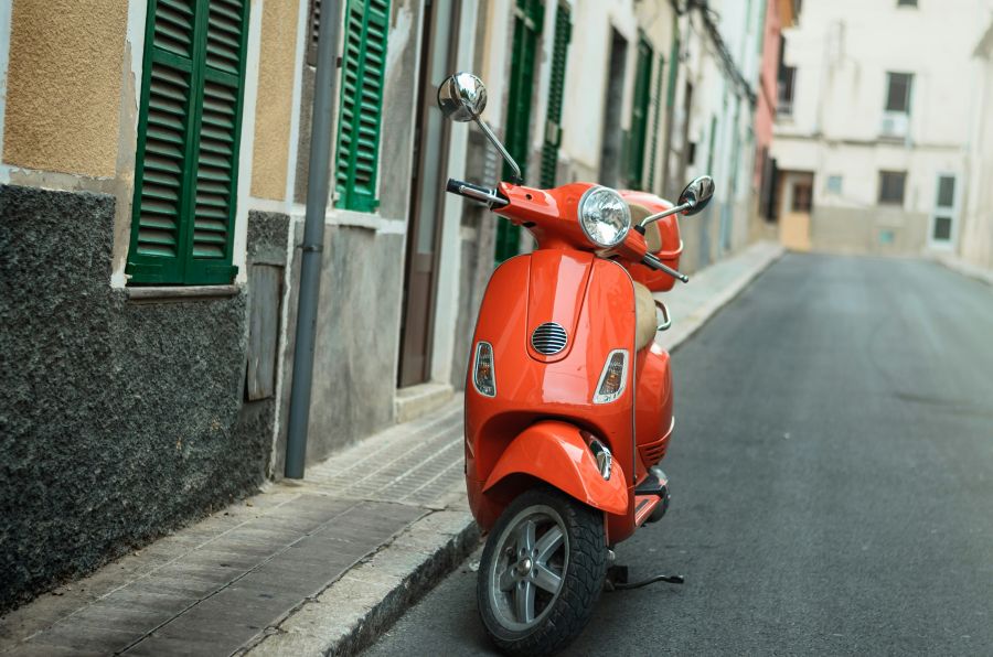 transport red scooter  in barcelona 