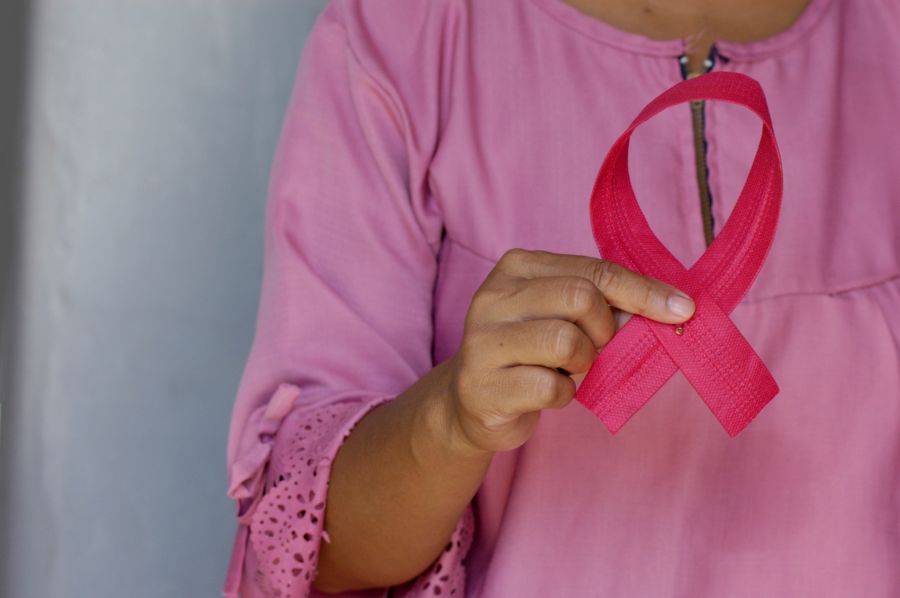 Breast cancer Woman holding a pink ribbon as an awareness of Breast Cancer Day, October, 1, 2020. indonesia,west java,bekasi city