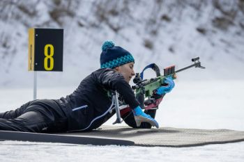 Biathlon training biathlon getting into position prone shooting with biathlon rifle, biathlon competition nordic skiing