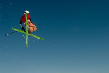 Ski Equipment A skier in the air, somewhere in the Austrian Alps. 