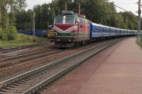 Railway tolls a passenger train overtakes a freight train on an adjacent track railway,train,platform