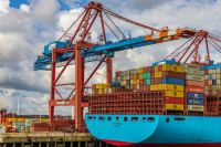 Port Our goods travel around the world in containers. Picture of a container ship in the port of Hamburg (Germany) hamburg,deutschland,port