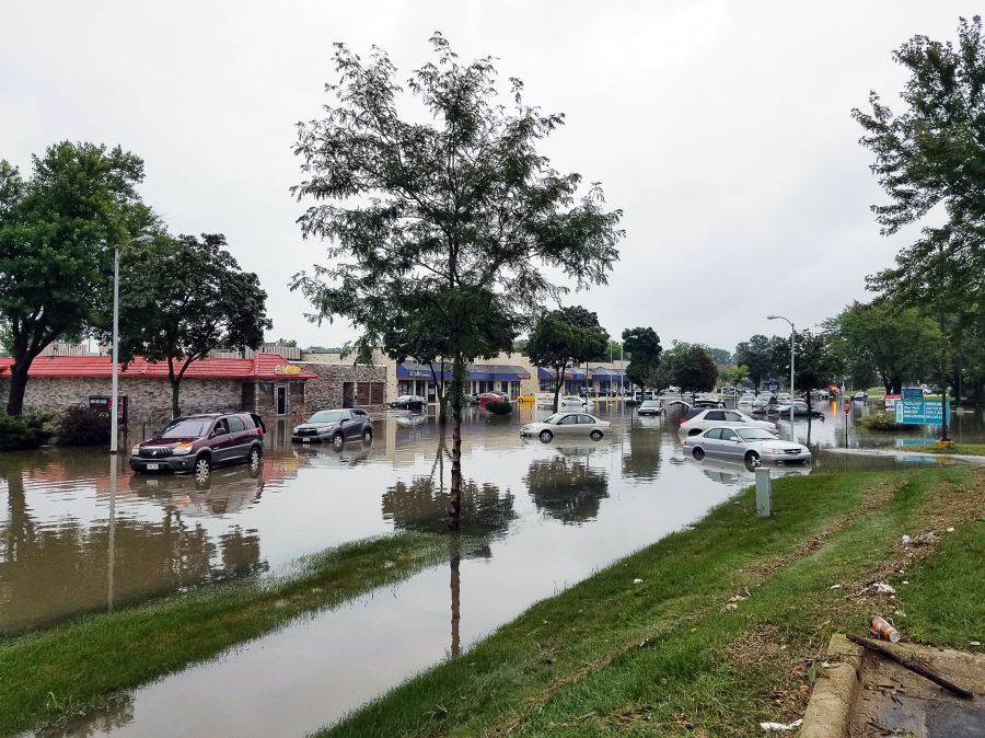 Flooding inundation Odana road in Madison, wi. We recently got heavy rain with a lot of flooding, this photo speaks for itself on the damage to the city. flooding,car,united states