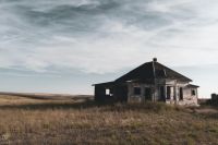 Abandoned house This is one of my top five favorite abandoned houses...not that I keep a list or anything... (message me if you want it haha) This one is creepy because it's so isolated and so damaged—about 20 miles from the nearest town, which only has about 500 people. This old home is also completely destroyed on the inside. I've uploaded a couple photos of the interior, which is covered in graffiti. The word 