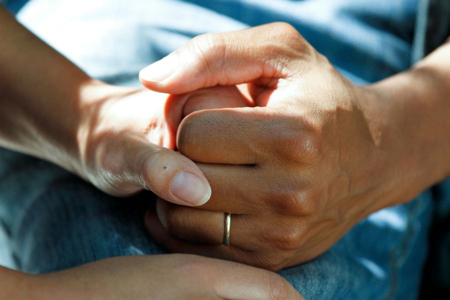 Survivor Couple Clasping Hands care,medical,holding hands