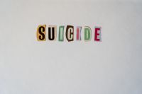 Suicide mental Suicide, cut out of letters from a magazine. suicide,word,letters