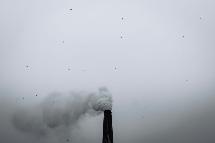 Air pollution Brick kiln chimney releasing smoke into a cloudy sky. Stack of 5 images. 