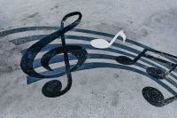Music climate Notes drawn on a muddy road. Horizontal background with musical notes 