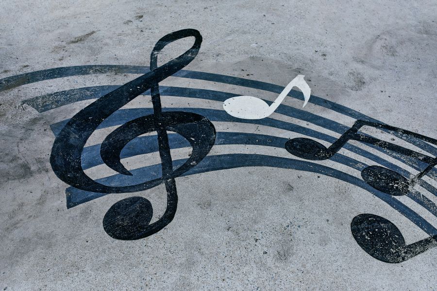 Music climate Notes drawn on a muddy road. Horizontal background with musical notes 