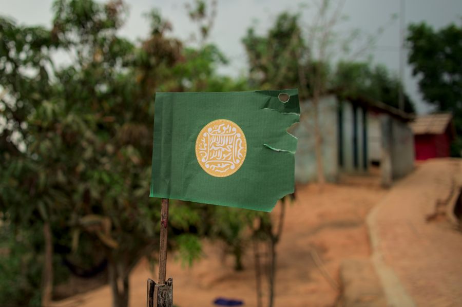 Identity Exile Standing strong in exile, the Rohingya flag flies as a symbol of identity, Refugee, Flag, Myanmar, Persecution, HumanRights, CampLife, Stateless, Solidarity, Identity, Hope, Struggle, Justice, Displacement, Resilience, Community, Activism, Survival, Freedom, Advocacy, 