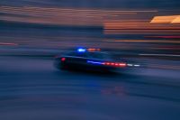 police chase Fast moving police car down a city street. 