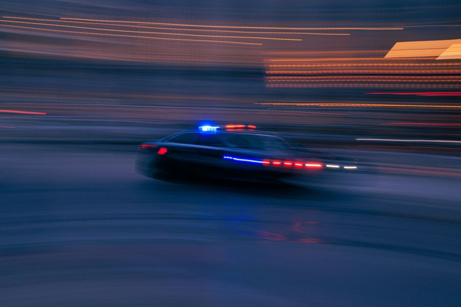 police chase Fast moving police car down a city street. 