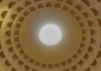 Roman light Pantheon Oculus - Sacred Light Through Ancient Rome’s Open Dome. Mesmerizing view of the Pantheon’s famous oculus, the circular opening at the apex of the coffered dome that serves as the only source of natural light. This architectural marvel showcases brilliant sunlight streaming through the 9-meter opening, illuminating the intricate geometric patterns of the coffered ceiling. The oculus has remained unchanged for nearly 2,000 years, creating a divine connection between earth and sky that tra
