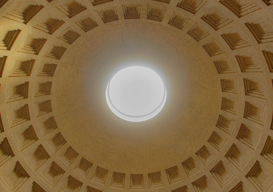 Roman light Pantheon Oculus - Sacred Light Through Ancient Rome’s Open Dome. Mesmerizing view of the Pantheon’s famous oculus, the circular opening at the apex of the coffered dome that serves as the only source of natural light. This architectural marvel showcases brilliant sunlight streaming through the 9-meter opening, illuminating the intricate geometric patterns of the coffered ceiling. The oculus has remained unchanged for nearly 2,000 years, creating a divine connection between earth and sky that tra 