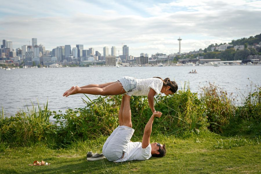 Acrobatics Couple doing acros yoga at Gasworks Park in Seattle, Washington 