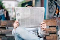 News Person reading a newspaper 