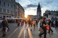 Tourism Tourists on Main Market Square in Krakow, Poland. 