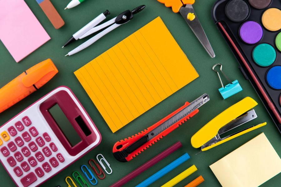 school supplies School office supplies stationery on a purple background desk with copy space. Back to school concept. 