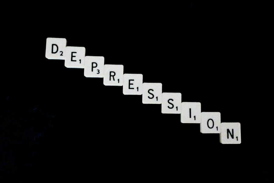 Depression Philosophy Depression, spelled out in white scrabble tiles. 