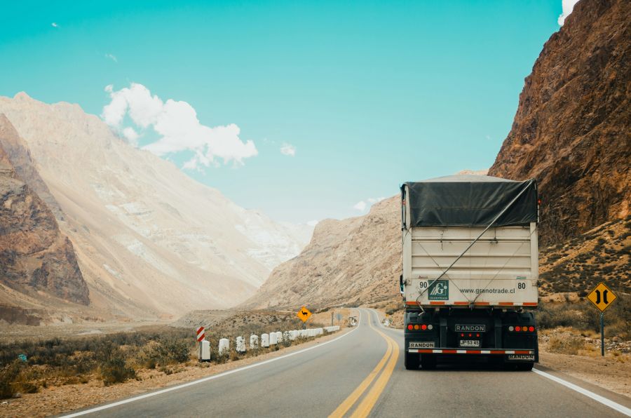 transportation truck in between the mountains truck,argentina,mendoza