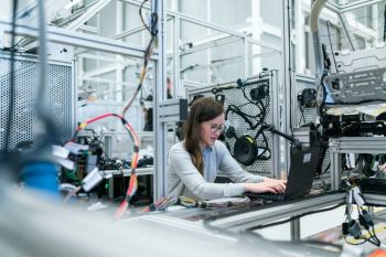 technology innovation Female electronics engineer runs vehicle tests