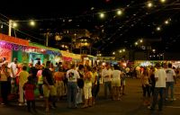 village festival A crowd begins to gather at the carnival village. 