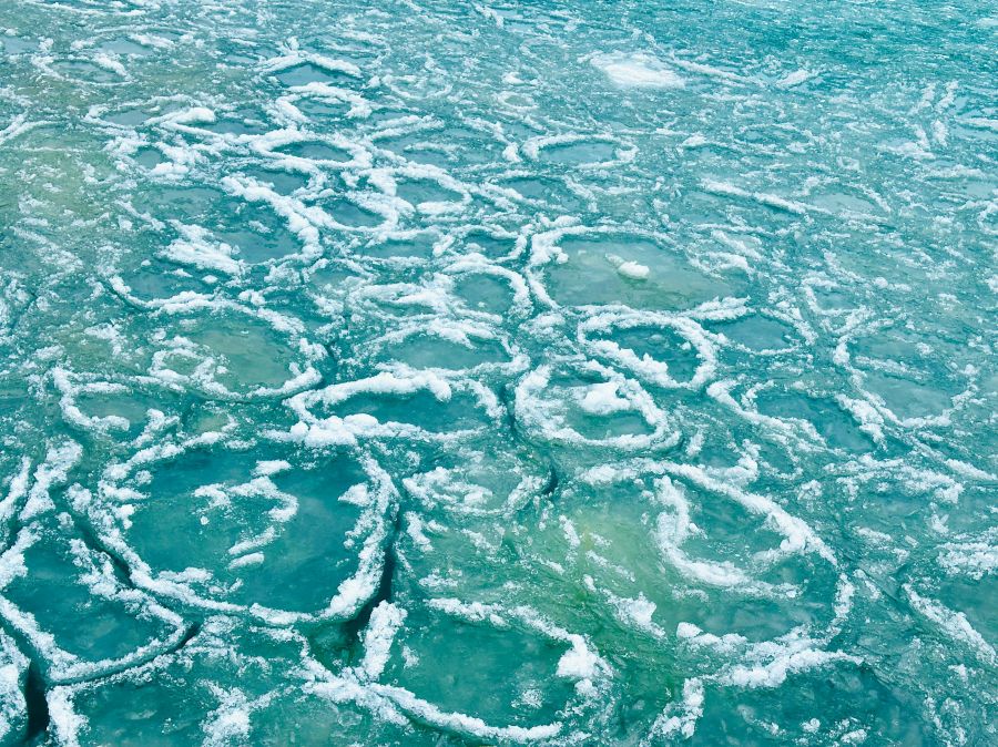 Solidarity Water In the middle of the ice and water of Lake Michigan. Ice formations in Lake Michigan in Chicago. This week ice pancakes were found along Chicago’s shoreline of Lake Michigan. united states,solidarity dr,winter