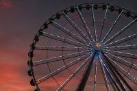 Carnival festivity Sunset after taking a ride on this Ferris wheel. Straight out of camera, velvia JPEG. Towering 200 feet tall, the Great Smoky Mountain Wheel sits at the foot of the most visited National Park in the United States–Great Smoky Mountain National Park. As the centerpiece to the Island in Pigeon Forge, it stands as one of the tallest attractions in the Southeast! ferris wheel,pigeon forge,circle