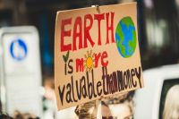 Climate activists EARTH IS MORE VALUABLE THAN MONEY. Global climate change strike - No Planet B - 09-20-2019 climate change,fridays for the future,protest