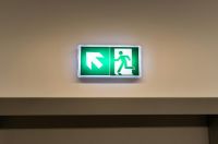 Evacuation exit emergency sign above door 