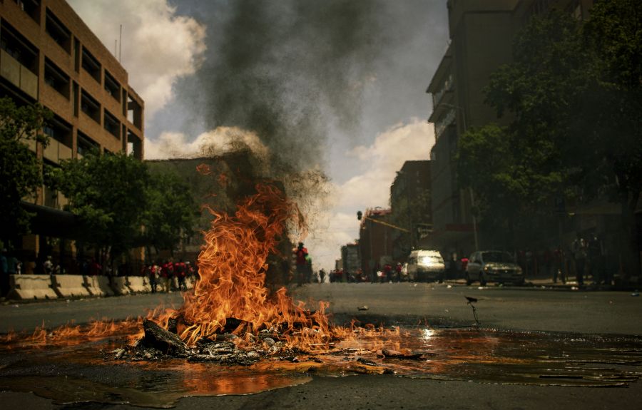 fire protest During 2016 South Africa experienced many protests. Most of them were around tertiary education fees. In November 2016, the Economic Freedom Fighters (EFF) party of South Africa took to the streets of Pretoria.

It was mostly calm as the EFF had several marshals walking with the various clusters. Despite the massive police presence, there were a handful of vandals and pyromaniacs around. 

I also got pelted with a few stones in the process. 