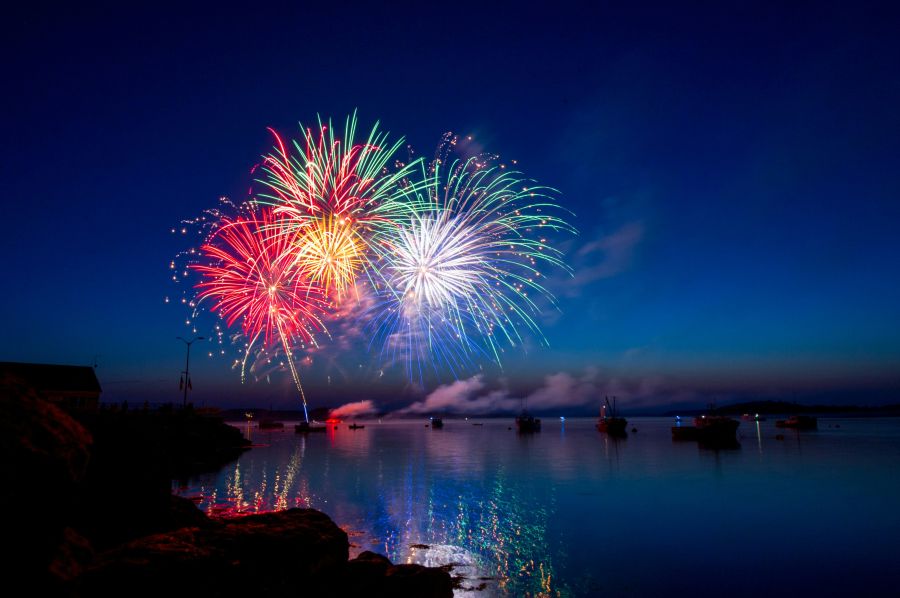 Fireworks Celebration A fireworks display in the harbor of Lubec Maine.  The dusk sky, water and boats provided a beautiful setting for the colorful show. firework,water,night