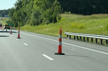 Highway closure Orange highway construction cones on the road